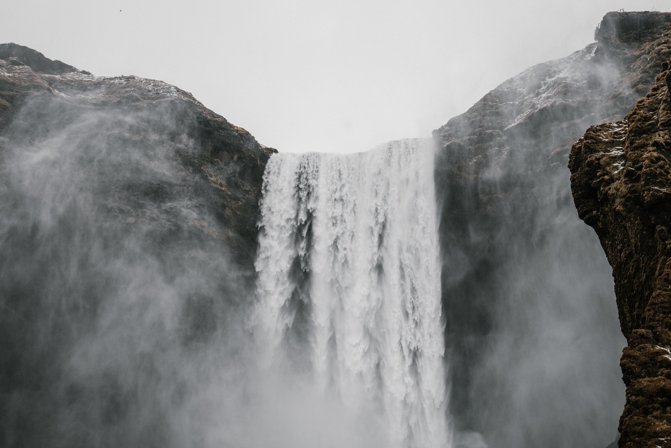 Severe waterfall with cold water in rocky terrain